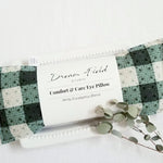 eucalyptus eye pillow with green and cream plaid and dried eucalyptus leaves