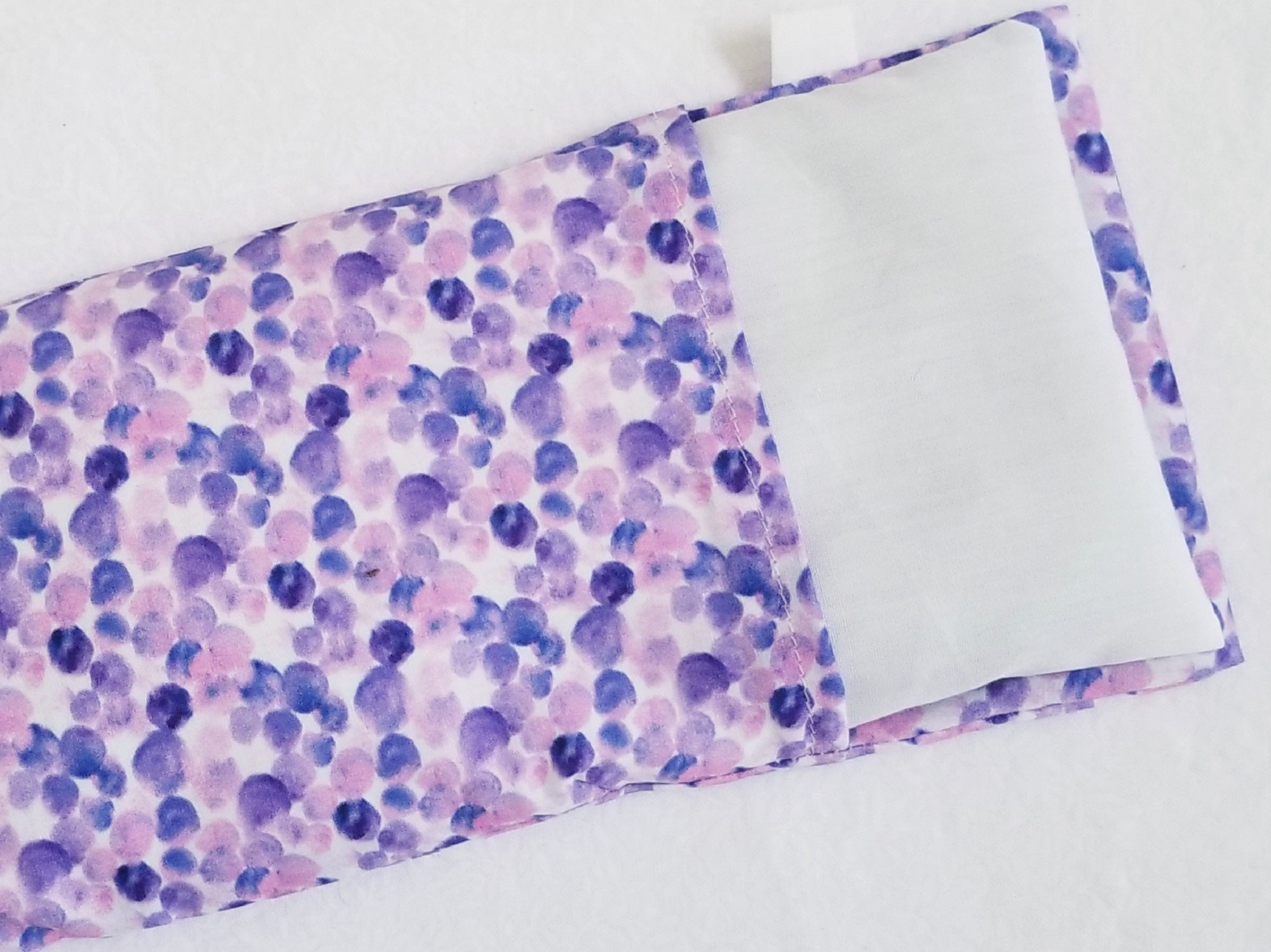 Close up of Blue Dot Eye Pillow washable outside cover and muslin inner cover