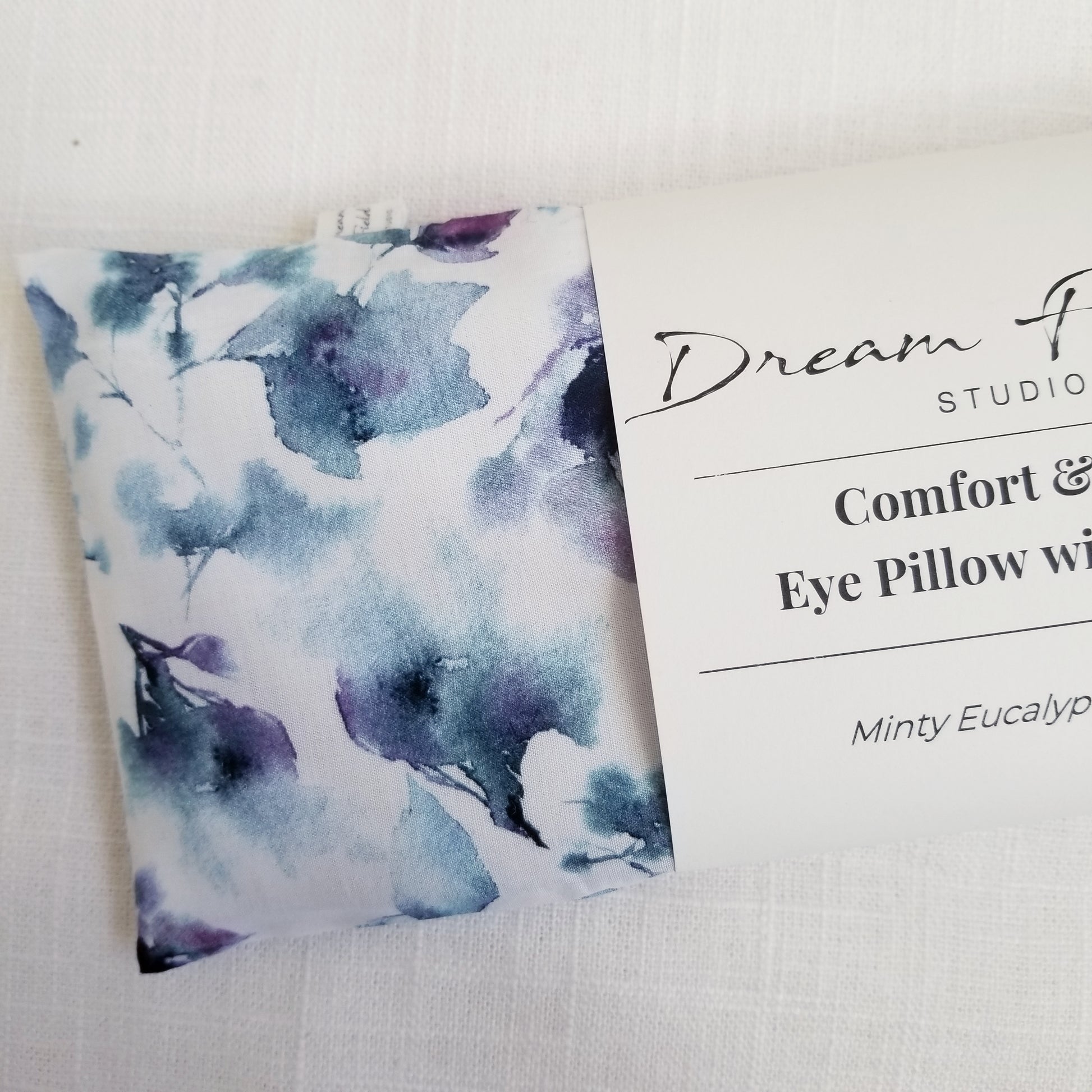 Close up of blue watercolor sketch cotton fabric eye pillow cover