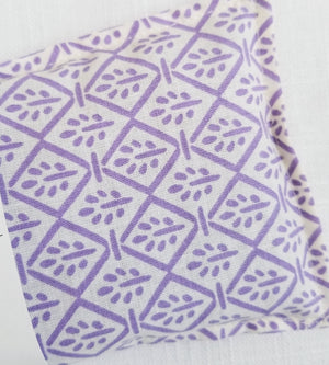 closeup of lavender flowers on flax seed eye pillow