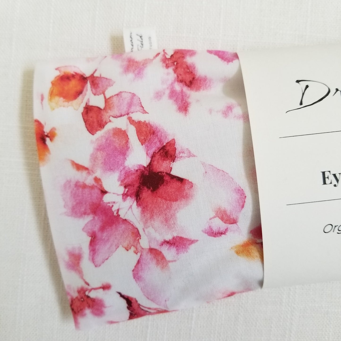 Closeup of pink spa watercolor print eye pillow Dreamfield Studio