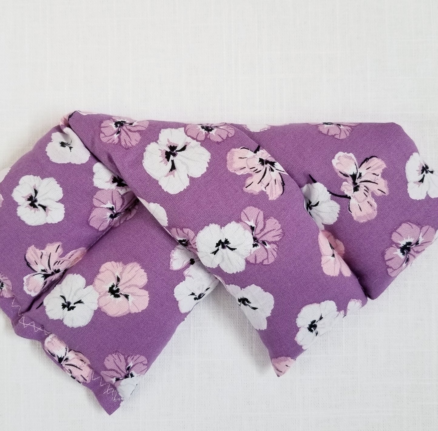 mini heat wrap Thermal Therapy Pack in mauve pansy print cotton bag