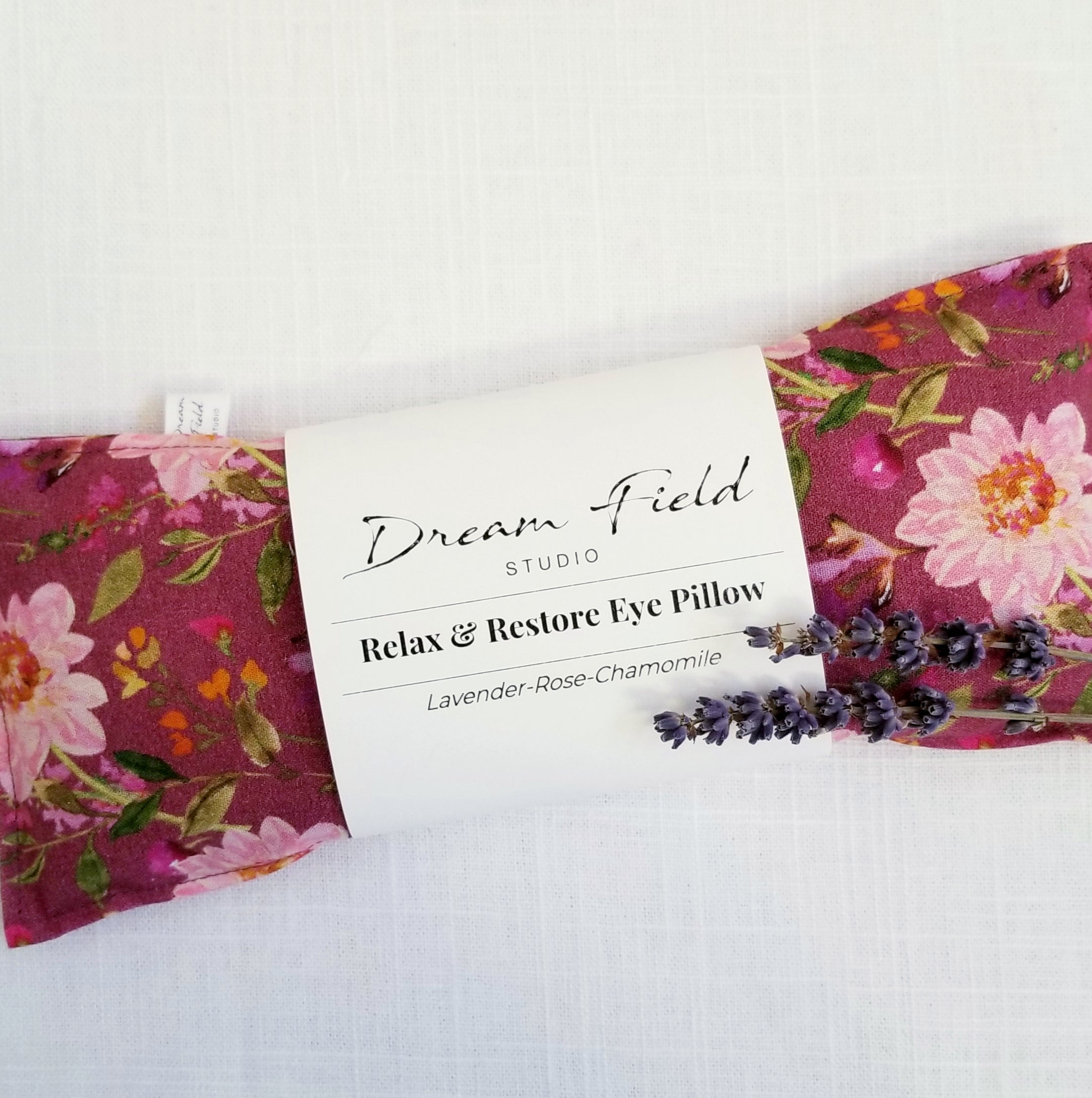 lavender eye pillow with Dream Field Studio label on front and 2 lavender stems