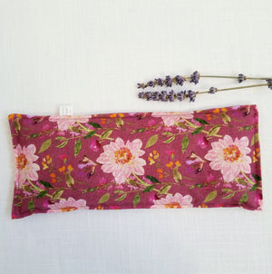 lavender eye pillow with deep rose floral laid flat
