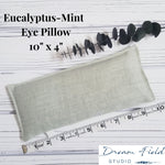 Size specifications for 10" x 4" eucalyptus-mint eye pillow and sprig of eucalyptus by Dream Field Studio