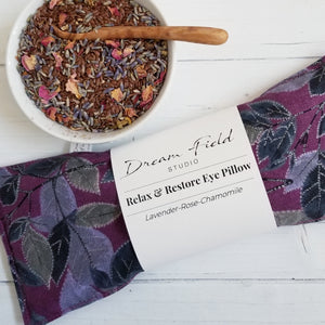 lavender flax seed eye pillow with bowl of herbs