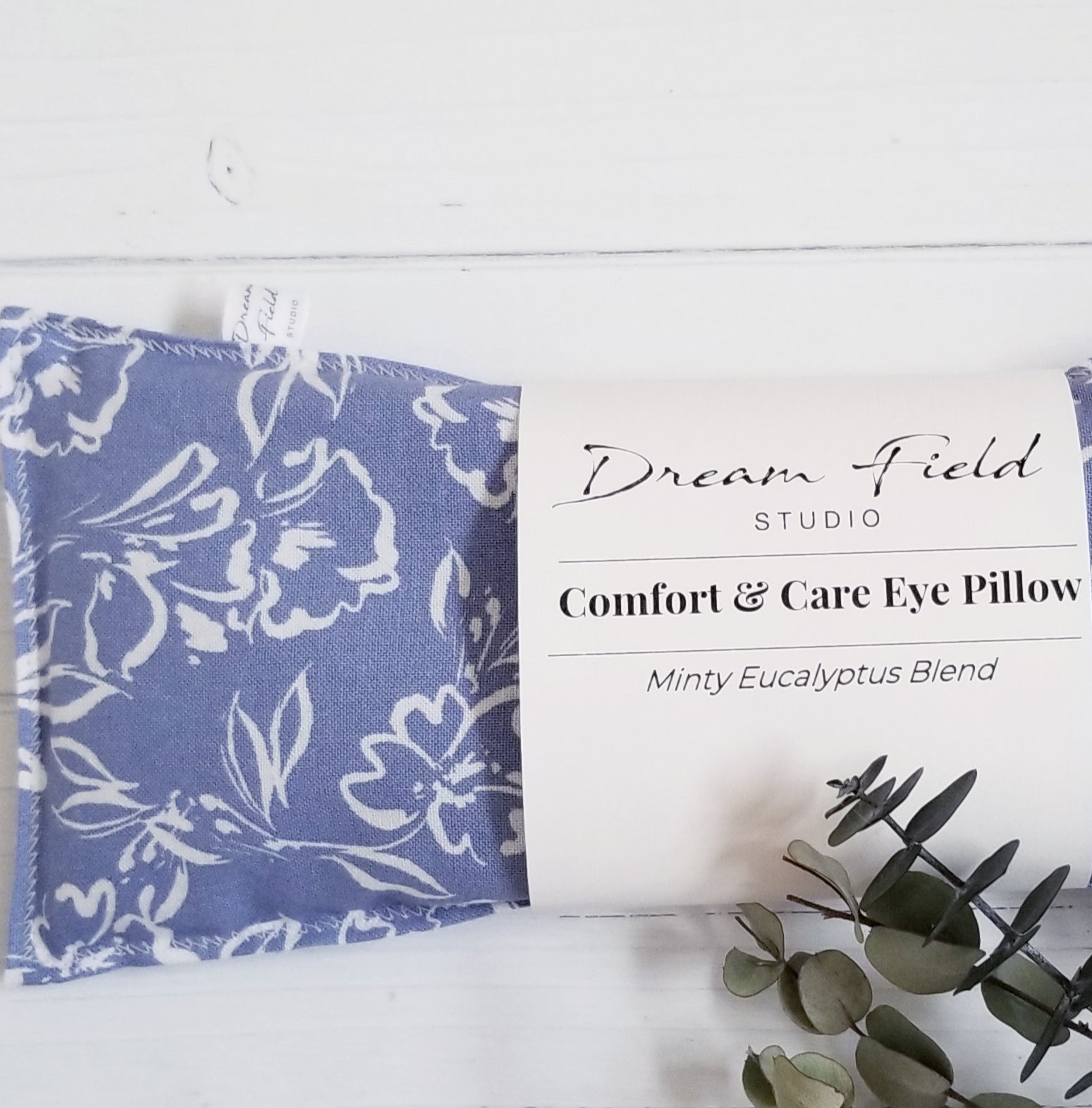 Minty eucalyptus eye pillow monet blue with sprig of eucalyptus by Dream Field Studio