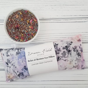 lavender eye pillow in pastel sketch fabric with bowl of dried herbs