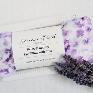 Eye pillow in watercolor floral print on cotton. Sprig of organic lavender.