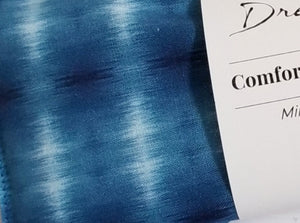 closeup of blue comfort & care pillow blue shibori print